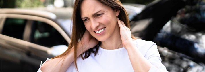 A visual example of a patient experiencing neck pain and stiffness, which are common symptoms of whiplash after a car accident in Yakima WA.