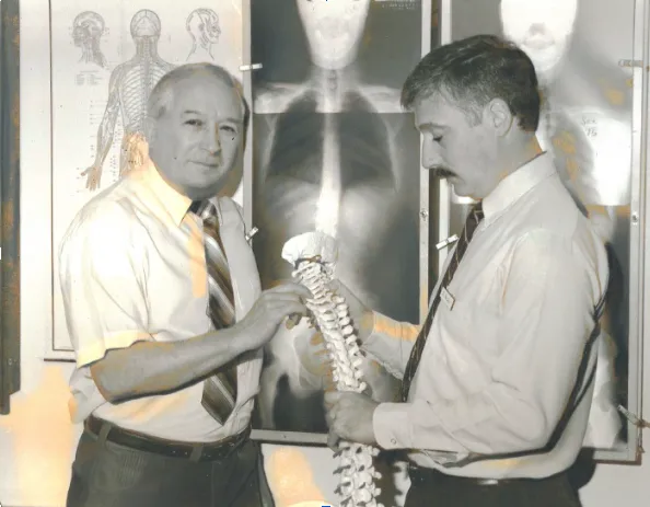 Dr. Clarence K. Lally and Dr. Tom Lally in the Yakima chiropractic office, continuing the family tradition of chiropractic care