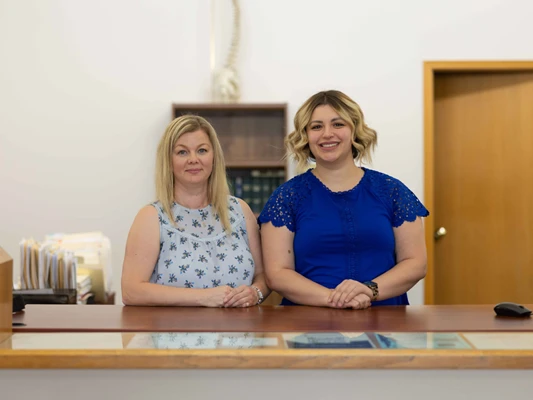 The friendly reception and front office team welcoming patients at Lally Chiropractic Clinic in Yakima, WA.