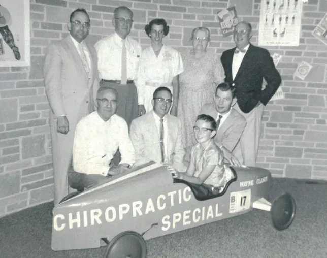 Dr. Clarence K. Lally with family members and patients at a chiropractic community event in the early 1960s in Yakima WA